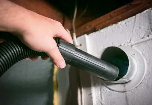 Vacuum attachment cleaning an exhaust duct opening