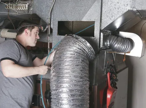 Cleaning flex ductwork at a furnace in a utility closet